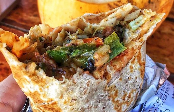 The Surfin Burrito signature dishes Mahi Shrimp Burrito, Customizable Burritos, Fish Tacos, Ceviche.